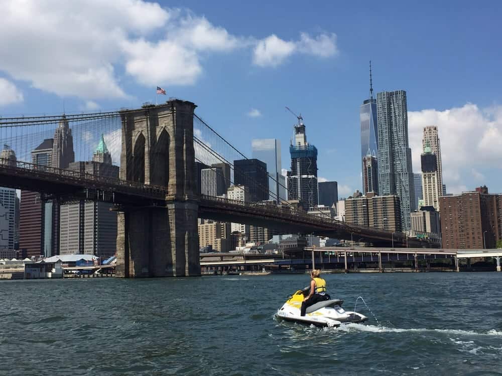 Jet skiing by the Brooklyn Bridge